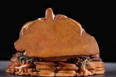 玩家旧藏，田黄石浮尘罗汉摆件  规格：高16cm长16.5cm宽9cm重1613g 藏品以高山田黄石为材，大料雕刻，刻画罗汉形象传神，开脸慈祥，衣饰飘逸，手持浮尘，等级高，栩栩如生，刀功老辣，整器包浆厚重，用料上乘，实为石雕之美。